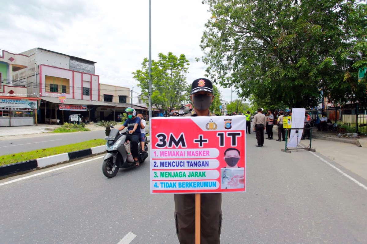 Pjs Bupati Siak Sosialisasikan Penindakan Disiplin Non Yustisi Prokes Covid-19 ke Masyarakat Tualang