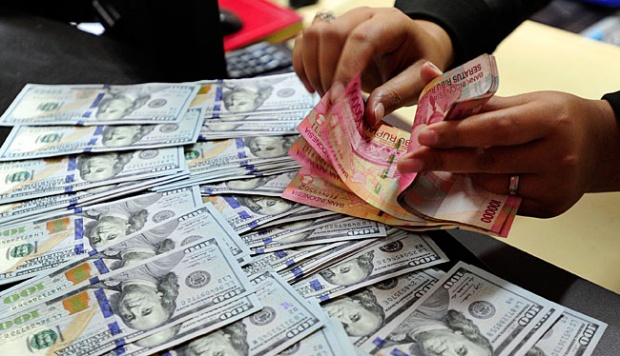 Rupiah Pagi ini Melemah ke Rp14.605 per Dolar AS