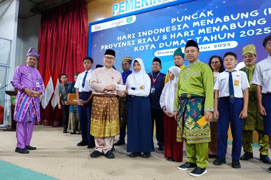 Dorong Inklusi Keuangan, OJK dan Pemprov Riau Ajak Pelajar Gemar Menabung