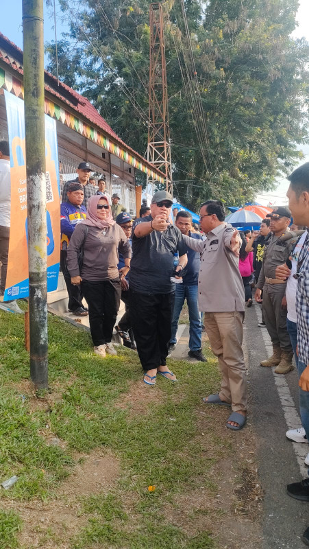 Sekretaris DPW NasDem Riau Yopi Arianto Disambut Bupati Kuansing di Festival Pacu Jalur