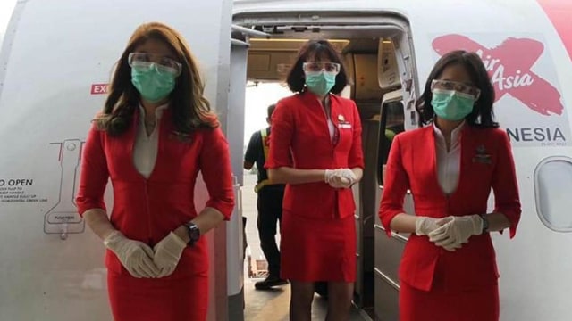 Begini Penampakan Seragam Protokol Kesehatan Pramugari AirAsia
